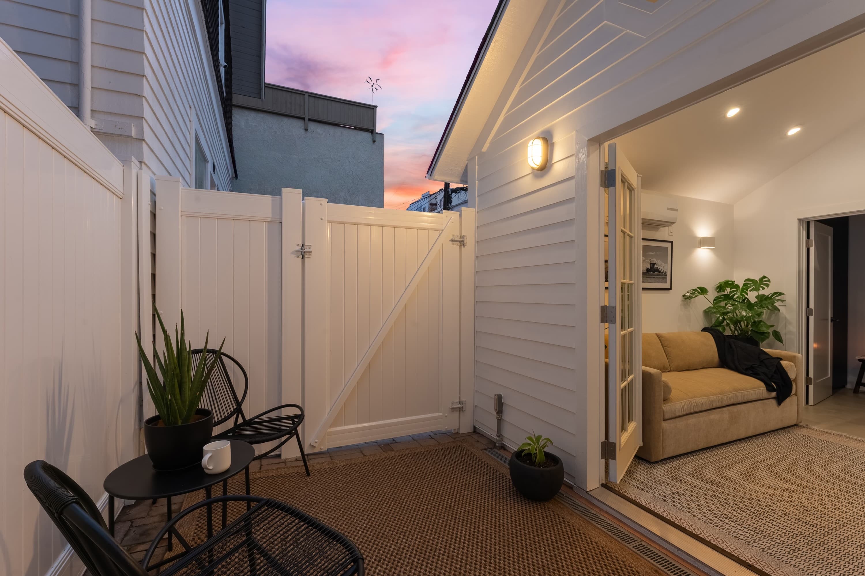 The patio at dusk, with the gate shut.