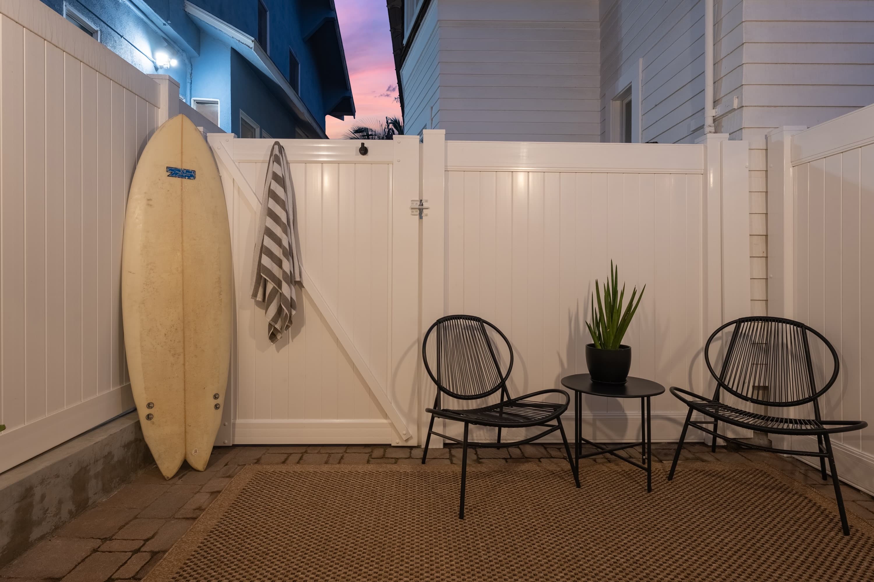 Room for two chairs and a table, and a wall to lean a board against.